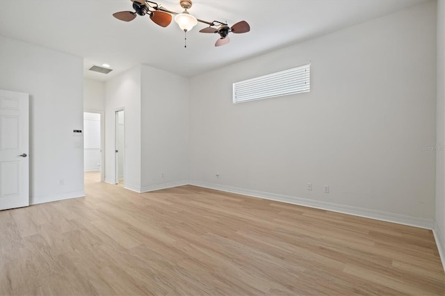 spare room featuring ceiling fan and light hardwood / wood-style flooring