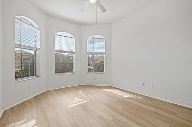 unfurnished room featuring ceiling fan and light hardwood / wood-style flooring