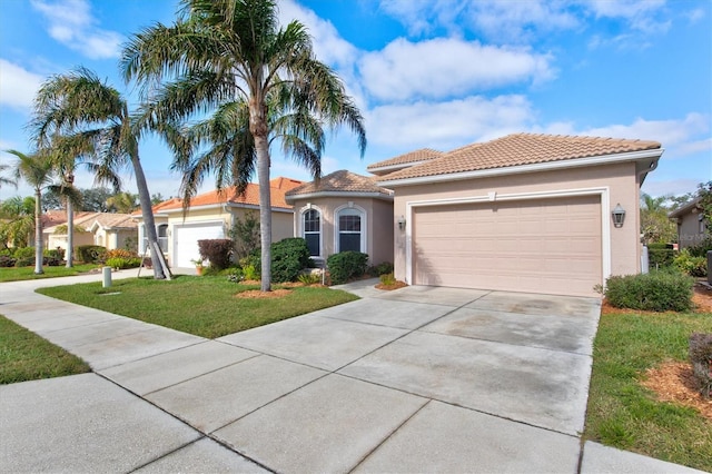 mediterranean / spanish-style home with a front lawn and a garage