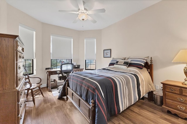 bedroom featuring ceiling fan and wood-type flooring