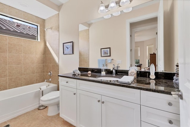 full bathroom with tile patterned floors, vanity, toilet, and tiled shower / bath