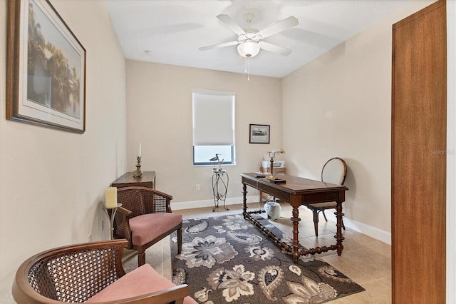 home office featuring light tile patterned floors and ceiling fan