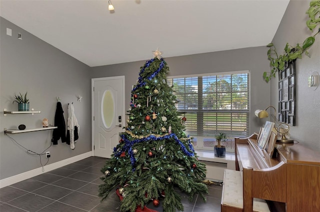 tiled foyer entrance with vaulted ceiling