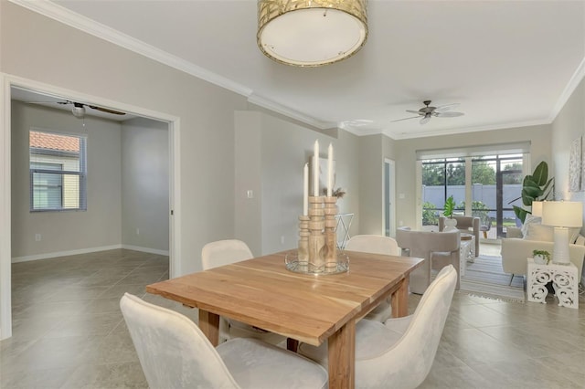 dining area featuring ceiling fan, light tile patterned flooring, and ornamental molding