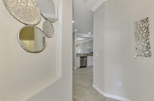 hallway featuring ornamental molding