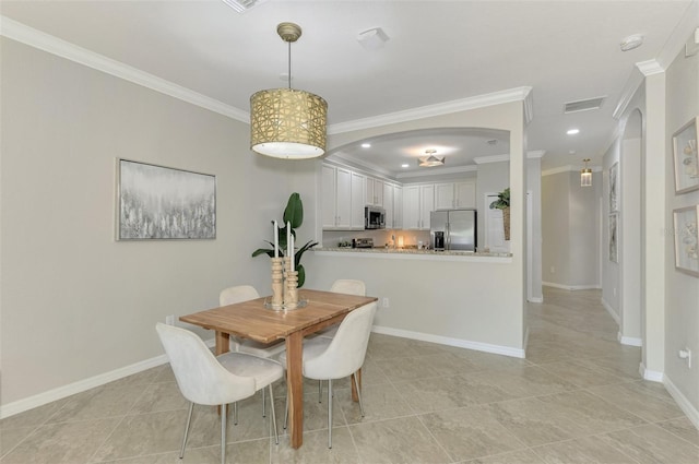 tiled dining room with ornamental molding