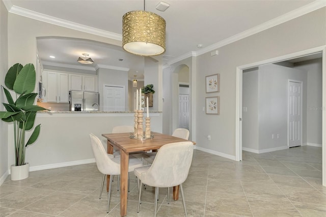 dining space featuring ornamental molding