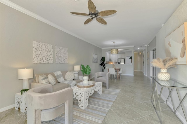 living room with ceiling fan and crown molding