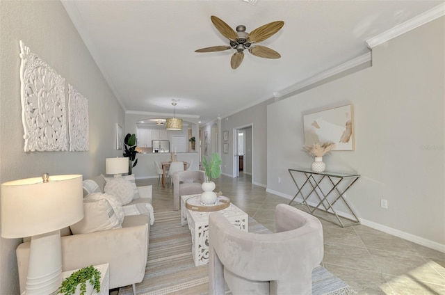 tiled living room featuring ceiling fan and crown molding