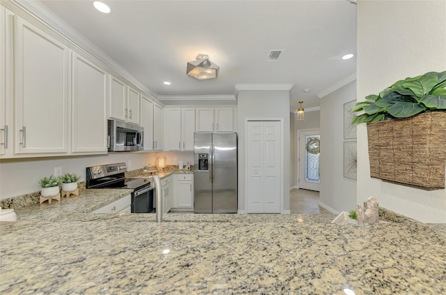 kitchen featuring light stone countertops, ornamental molding, appliances with stainless steel finishes, white cabinetry, and kitchen peninsula