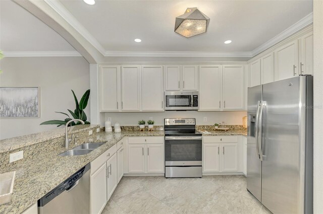 kitchen with white cabinetry, sink, ornamental molding, and stainless steel appliances