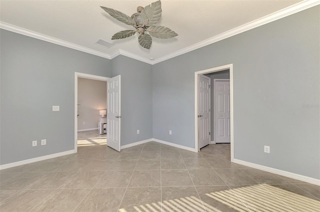 tiled spare room featuring ceiling fan and ornamental molding