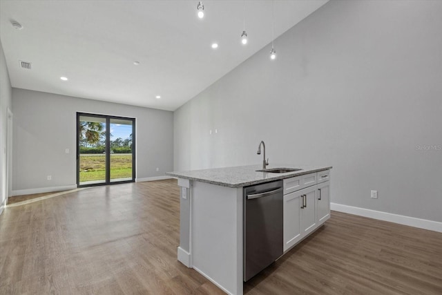 kitchen featuring white cabinetry, a center island with sink, stainless steel dishwasher, and wood-type flooring