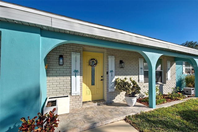 property entrance with covered porch