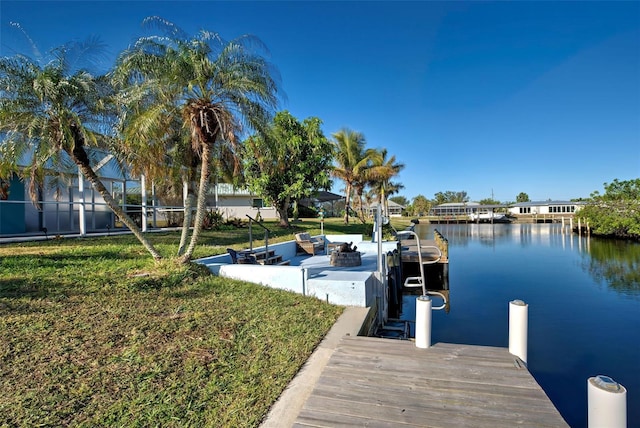 dock area featuring a yard and a water view