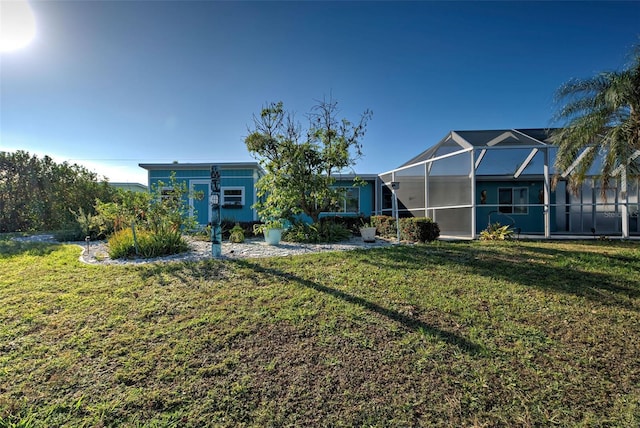 view of front facade with a lanai and a front yard