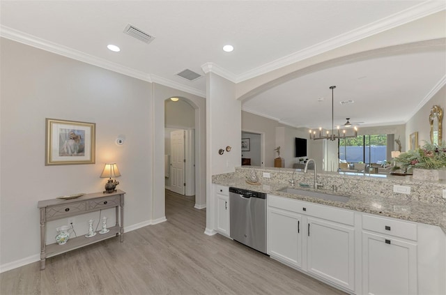 kitchen featuring sink, stainless steel dishwasher, light stone countertops, decorative light fixtures, and white cabinetry