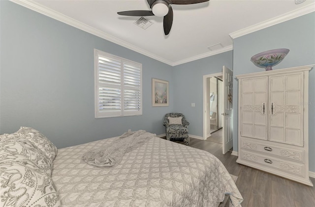 bedroom featuring ceiling fan, crown molding, and dark wood-type flooring