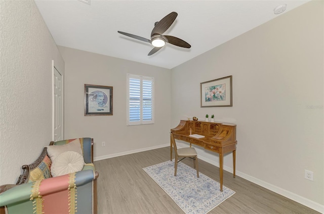 office area with ceiling fan and light hardwood / wood-style flooring