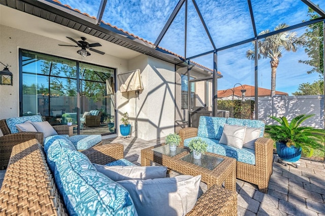 view of patio / terrace with ceiling fan and an outdoor living space