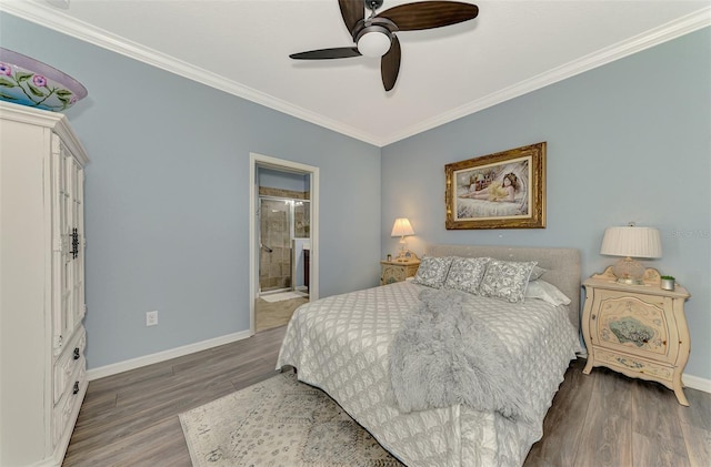 bedroom with ensuite bathroom, dark wood-style flooring, a ceiling fan, baseboards, and crown molding