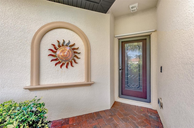 property entrance featuring visible vents