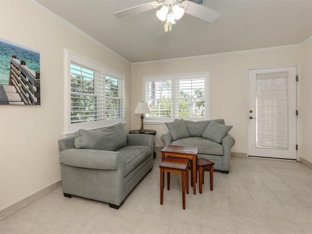 living room featuring ceiling fan, light tile patterned floors, and crown molding