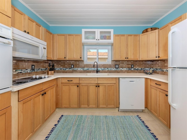 kitchen featuring light tile patterned floors, white appliances, tasteful backsplash, and sink