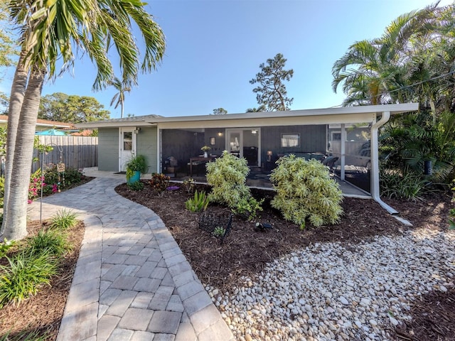 view of front of house featuring a sunroom