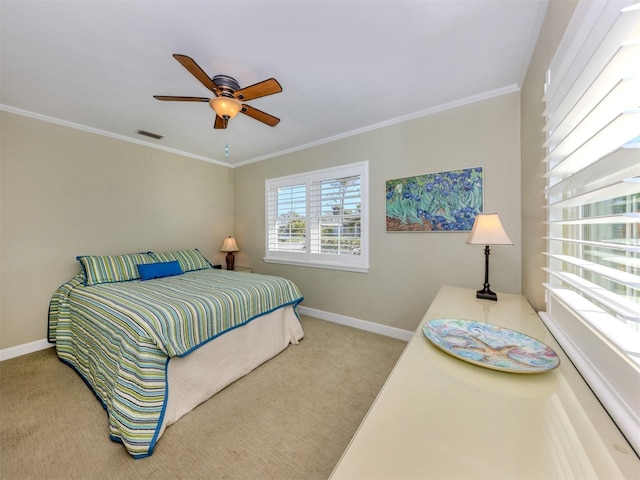 bedroom featuring carpet, ceiling fan, and crown molding