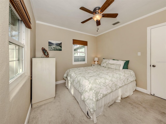 bedroom with ceiling fan, light colored carpet, and ornamental molding