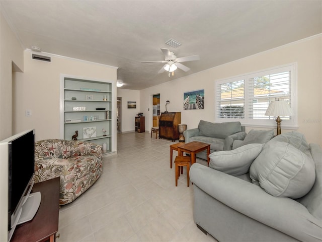 living room featuring ceiling fan and crown molding