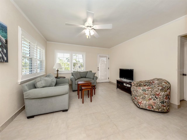 tiled living room with ceiling fan and crown molding