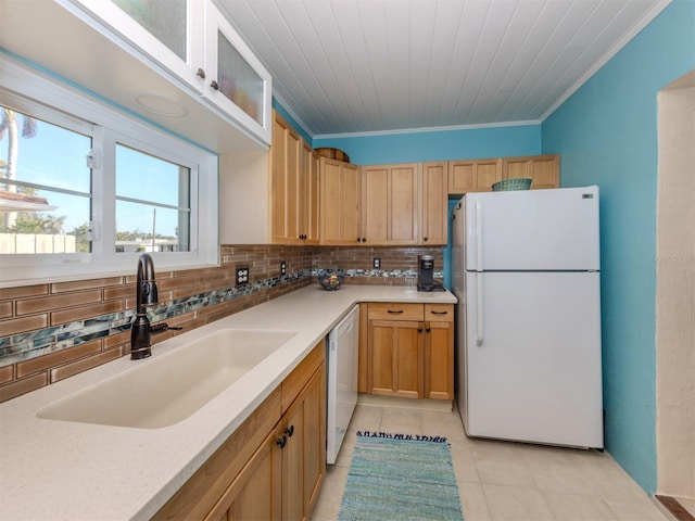 kitchen with tasteful backsplash, sink, white appliances, and ornamental molding