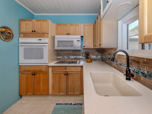 kitchen featuring decorative backsplash, white appliances, sink, and ornamental molding