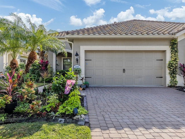 mediterranean / spanish-style home featuring a garage