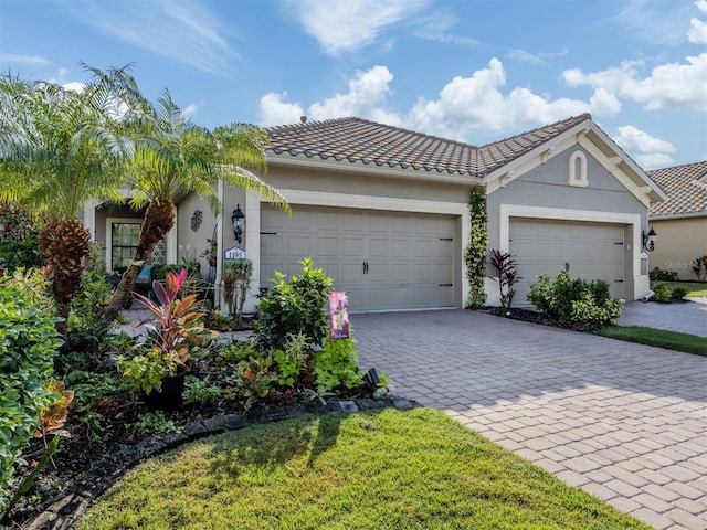 view of front of house with a front yard and a garage