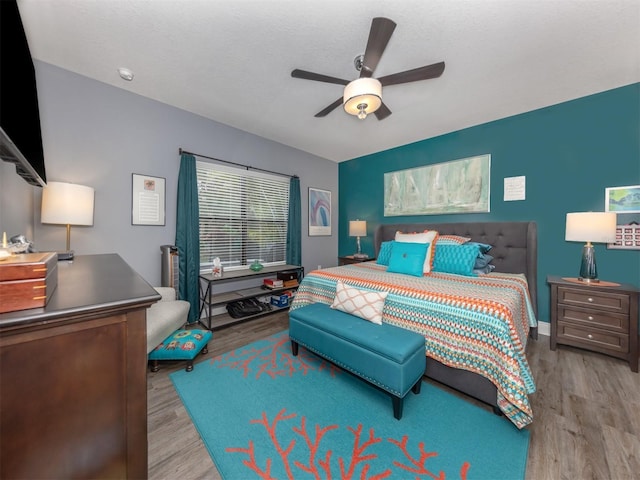 bedroom featuring ceiling fan and light wood-type flooring