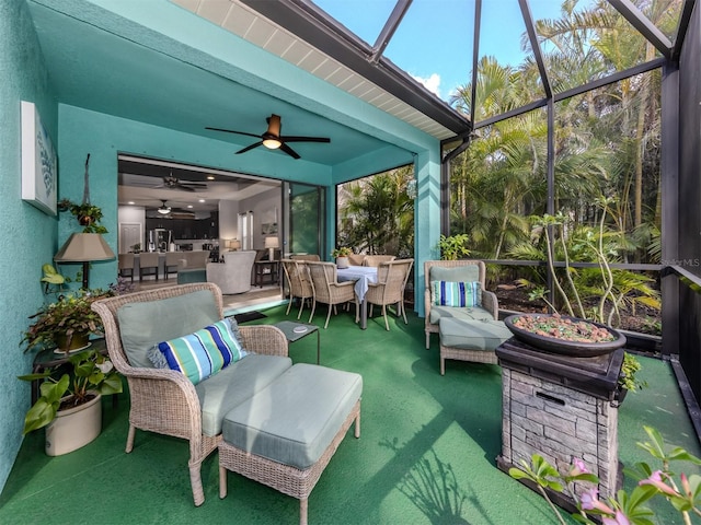 sunroom featuring ceiling fan