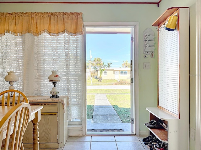 entryway featuring light tile patterned floors and a healthy amount of sunlight