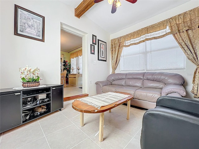 tiled living room featuring ceiling fan and lofted ceiling with beams