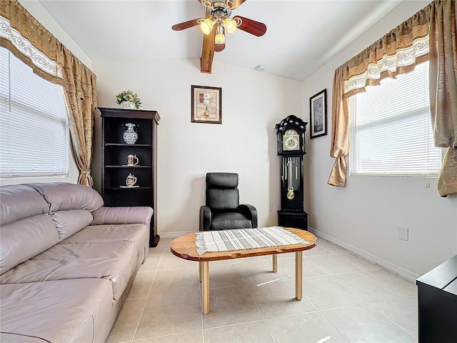 living room with vaulted ceiling with beams, ceiling fan, and light tile patterned floors