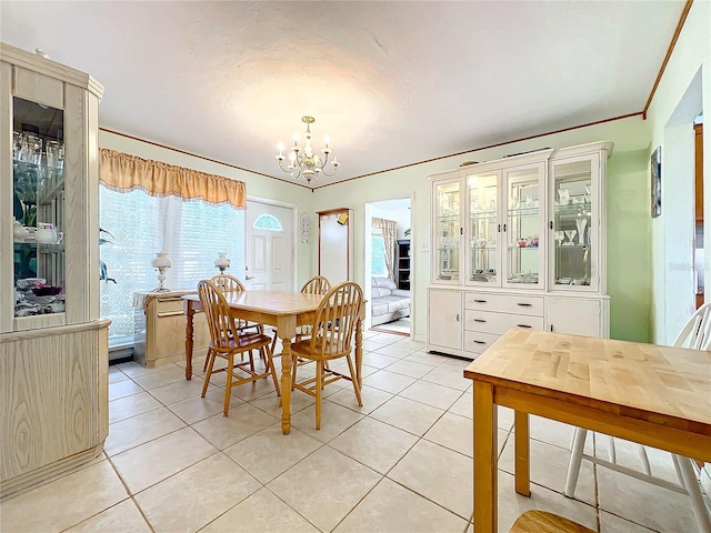 tiled dining area featuring an inviting chandelier