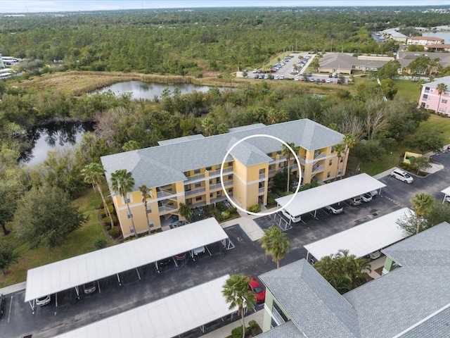 birds eye view of property with a water view