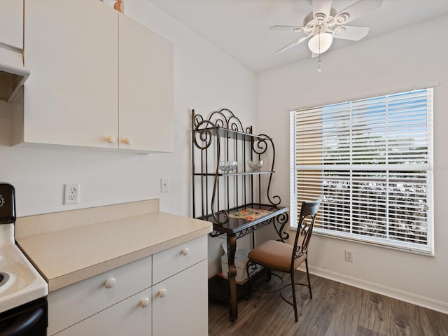 office with ceiling fan and dark hardwood / wood-style flooring