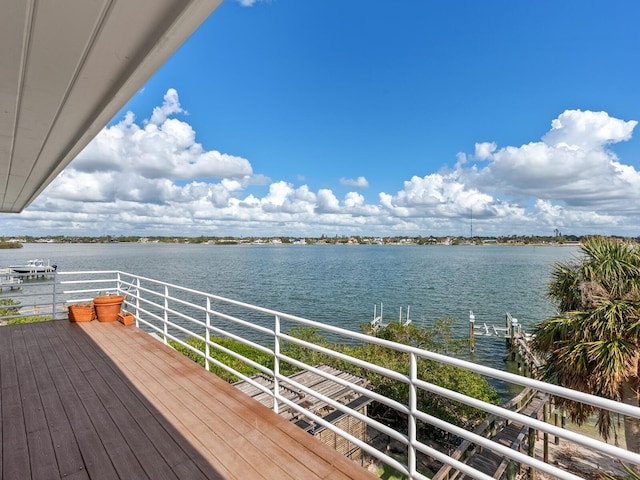 wooden deck featuring a water view