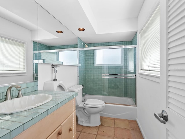 full bathroom featuring tile patterned floors, plenty of natural light, and enclosed tub / shower combo