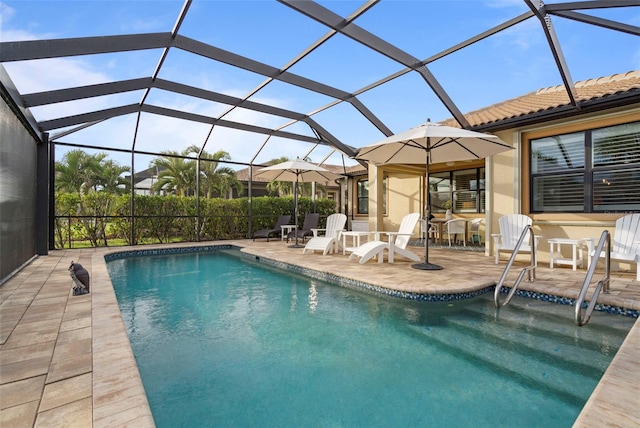 view of swimming pool with a patio and a lanai