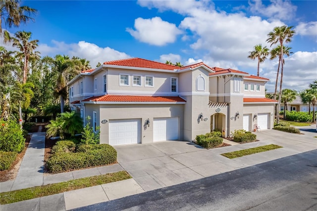 mediterranean / spanish house featuring a garage