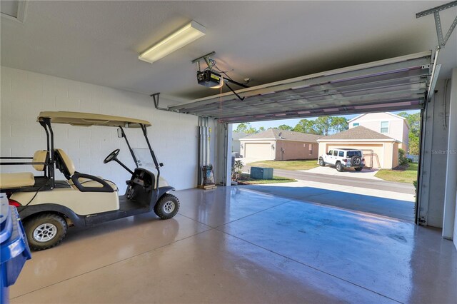 garage featuring a garage door opener